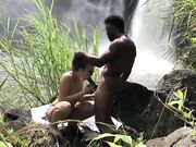 Remarkable outdoor interracial sexual intercourse by the waterfall